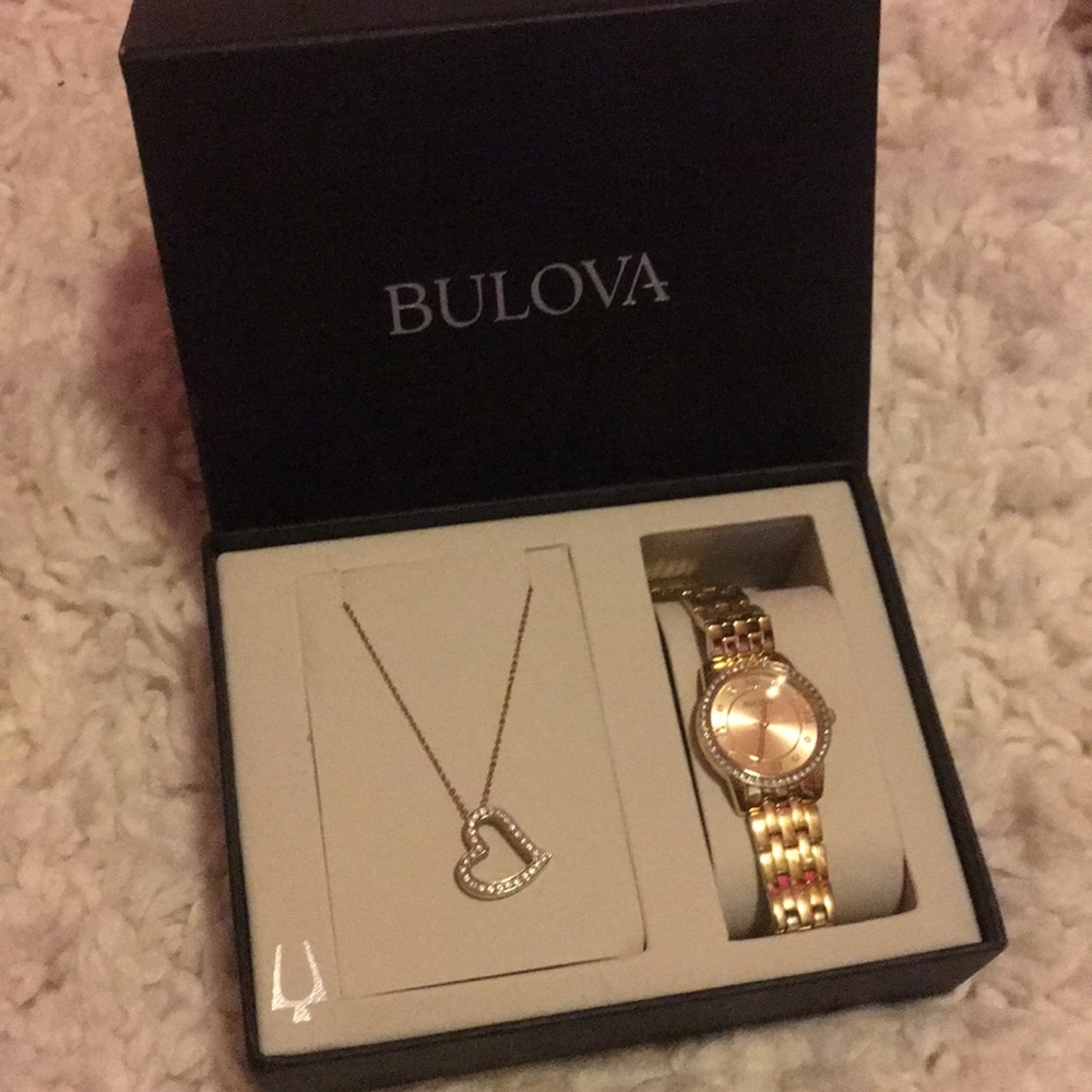 Brand new Gold Bulova heart necklace and watch set